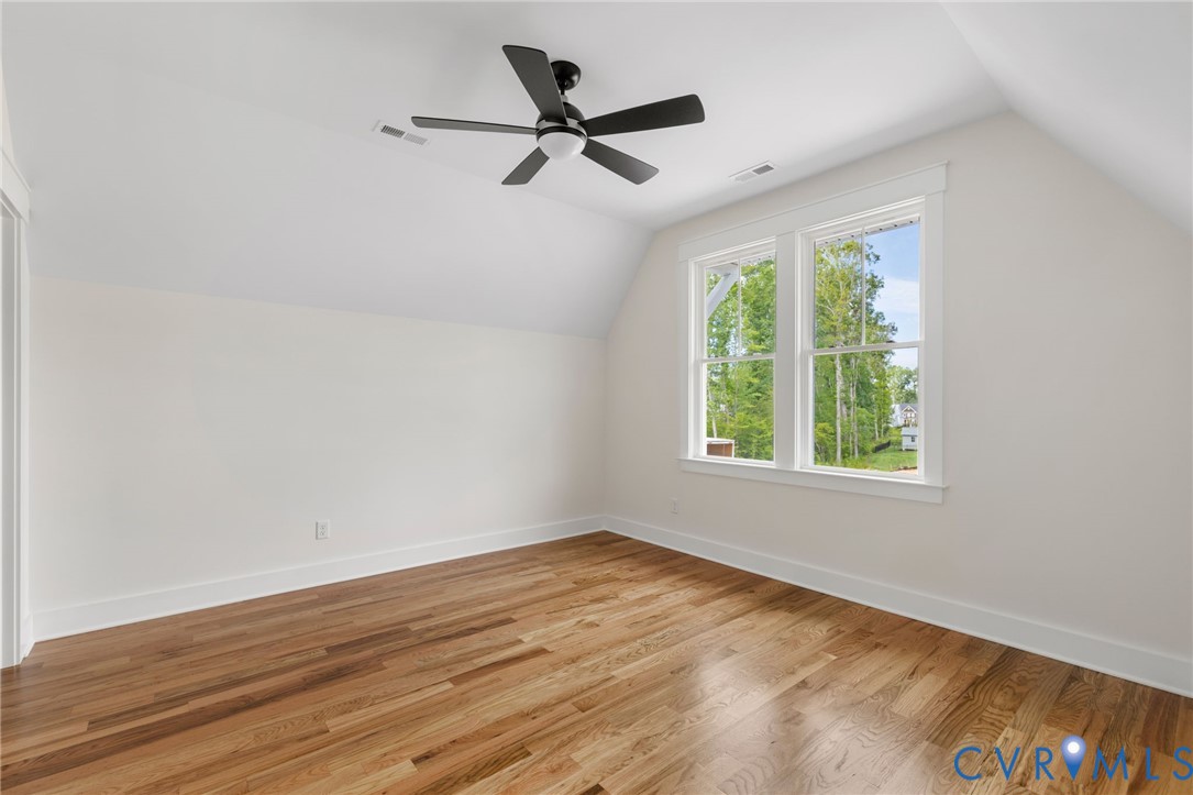 3525 Ampfield Way Midlothian, VA 23112 - Photo 17 of 35 a view of a livingroom with a ceiling fan and a large window