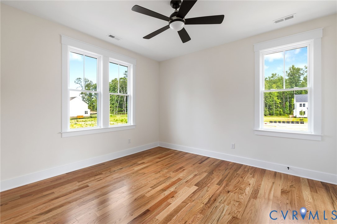 3525 Ampfield Way Midlothian, VA 23112 - Photo 20 of 35 a view of empty room with wooden floor and fan