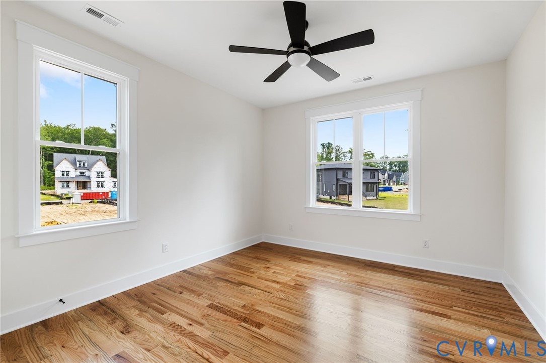 3525 Ampfield Way Midlothian, VA 23112 - Photo 23 of 35 a view of an empty room with window and wooden floor