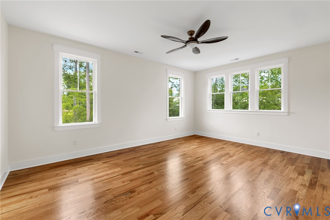 3525 Ampfield Way Midlothian, VA 23112 - Photo 25 of 35 a view of empty room with wooden floor and fan