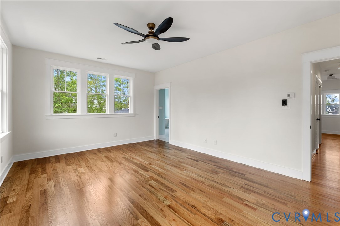 3525 Ampfield Way Midlothian, VA 23112 - Photo 26 of 35 an empty room with wooden floor and windows