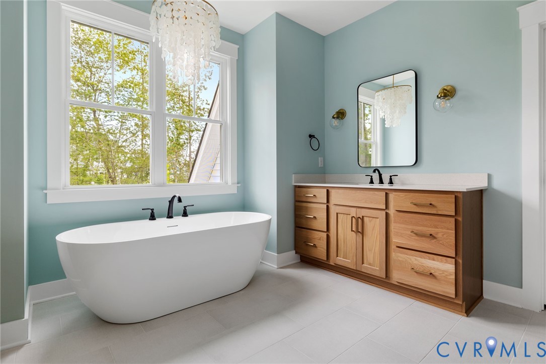 3525 Ampfield Way Midlothian, VA 23112 - Photo 27 of 35 a spacious bathroom with a double vanity sink mirror and bathtub