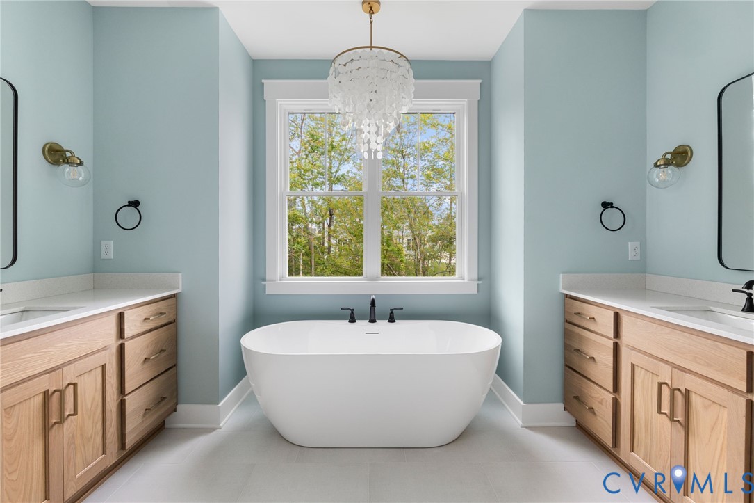 3525 Ampfield Way Midlothian, VA 23112 - Photo 28 of 35 a white bath tub sitting next to a bathroom sink