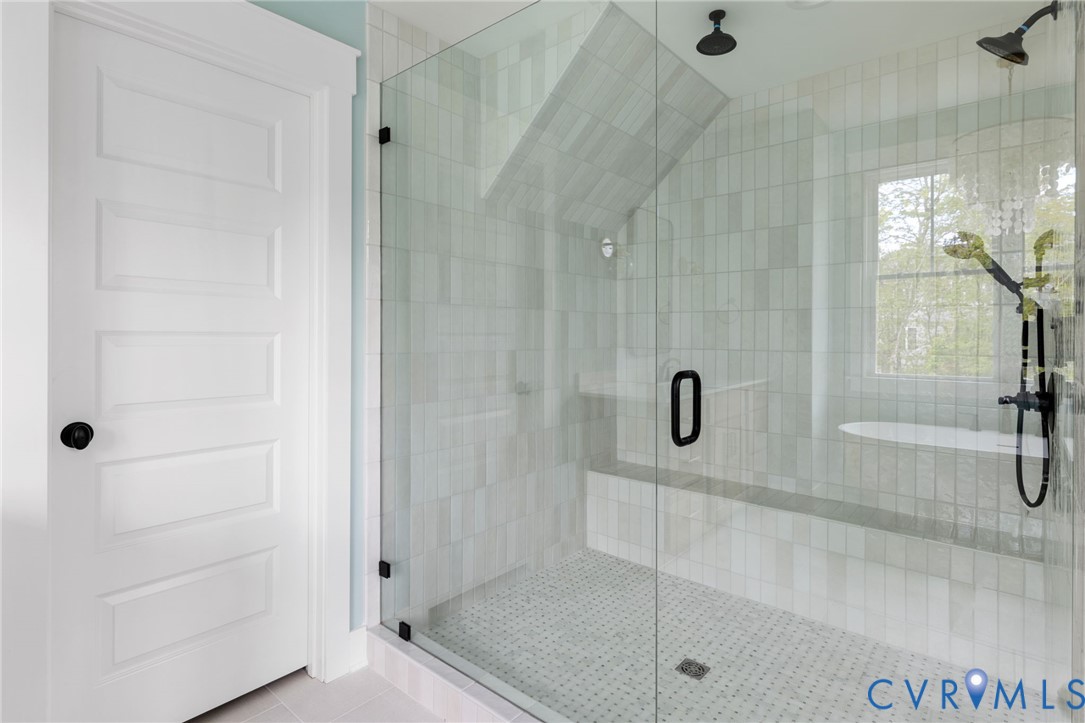 3525 Ampfield Way Midlothian, VA 23112 - Photo 33 of 35 a bathroom with a glass shower door