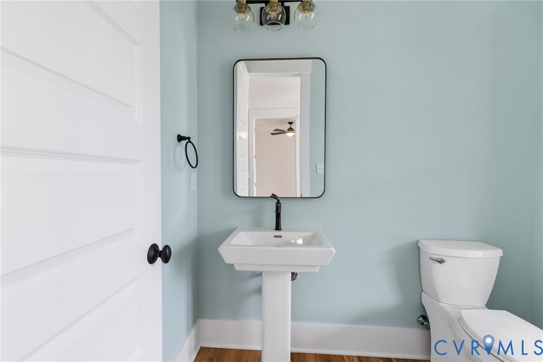 3525 Ampfield Way Midlothian, VA 23112 - Photo 4 of 35 a bathroom with a toilet sink and mirror