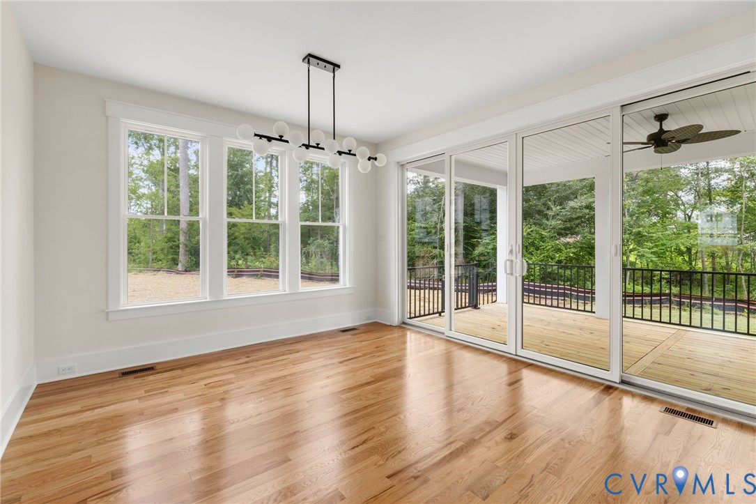 3525 Ampfield Way Midlothian, VA 23112 - Photo 7 of 35 a view of an empty room with wooden floor and a window