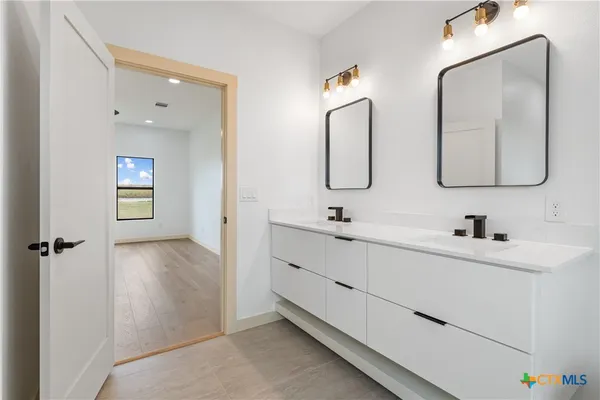 a bathroom with a toilet sink and shower
