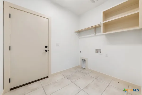 an empty room with closet and window