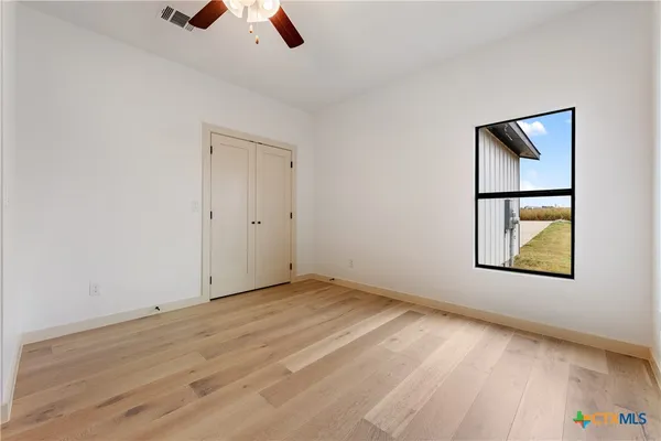 a bathroom with 2 sink and a mirror