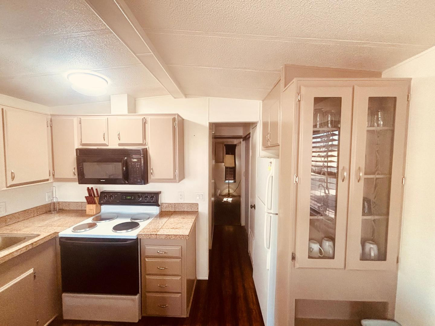 8865 East Baseline Road, Unit 405 Mesa, AZ 85209 - Photo 3 of 16 a kitchen with a stove and a refrigerator