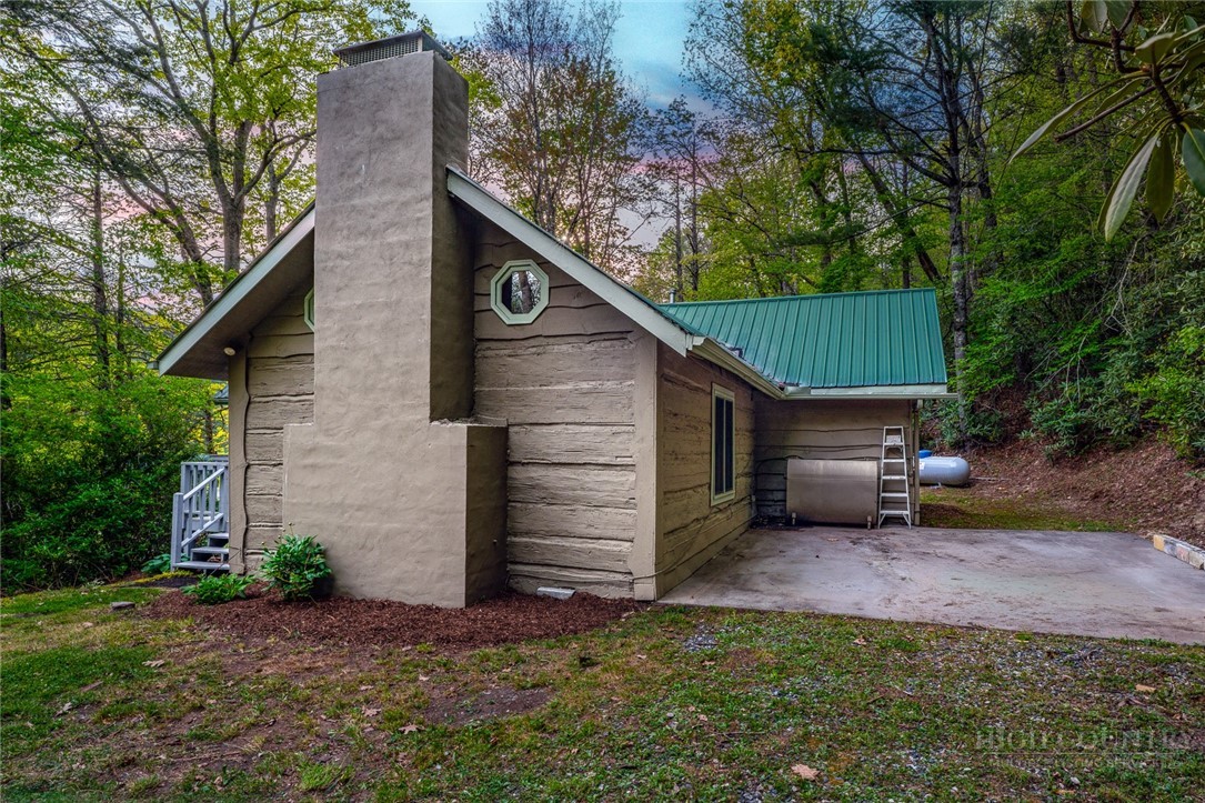 217 Holiday Hills Drive Boone, NC 28607 - Photo 2 of 26 a view of a house with a patio