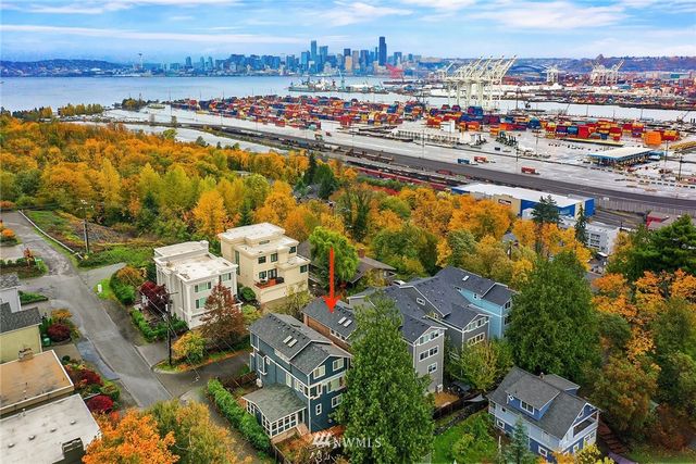 an aerial view of residential building and lake
