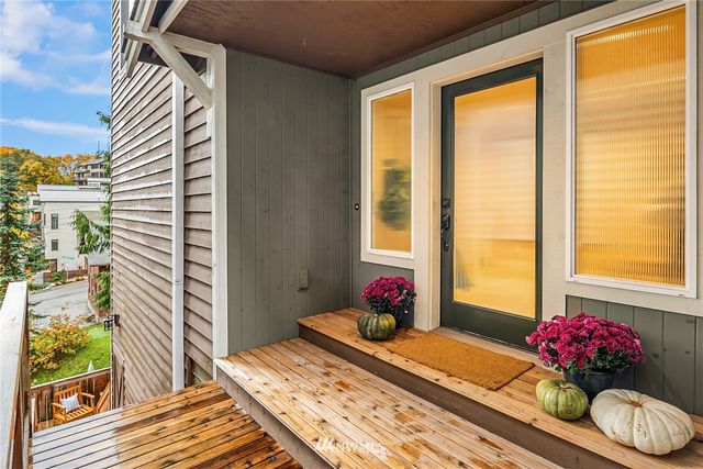 a bedroom with a bed and a potted plant