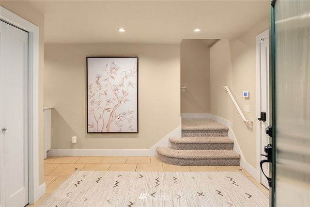 a view of staircase with white walls