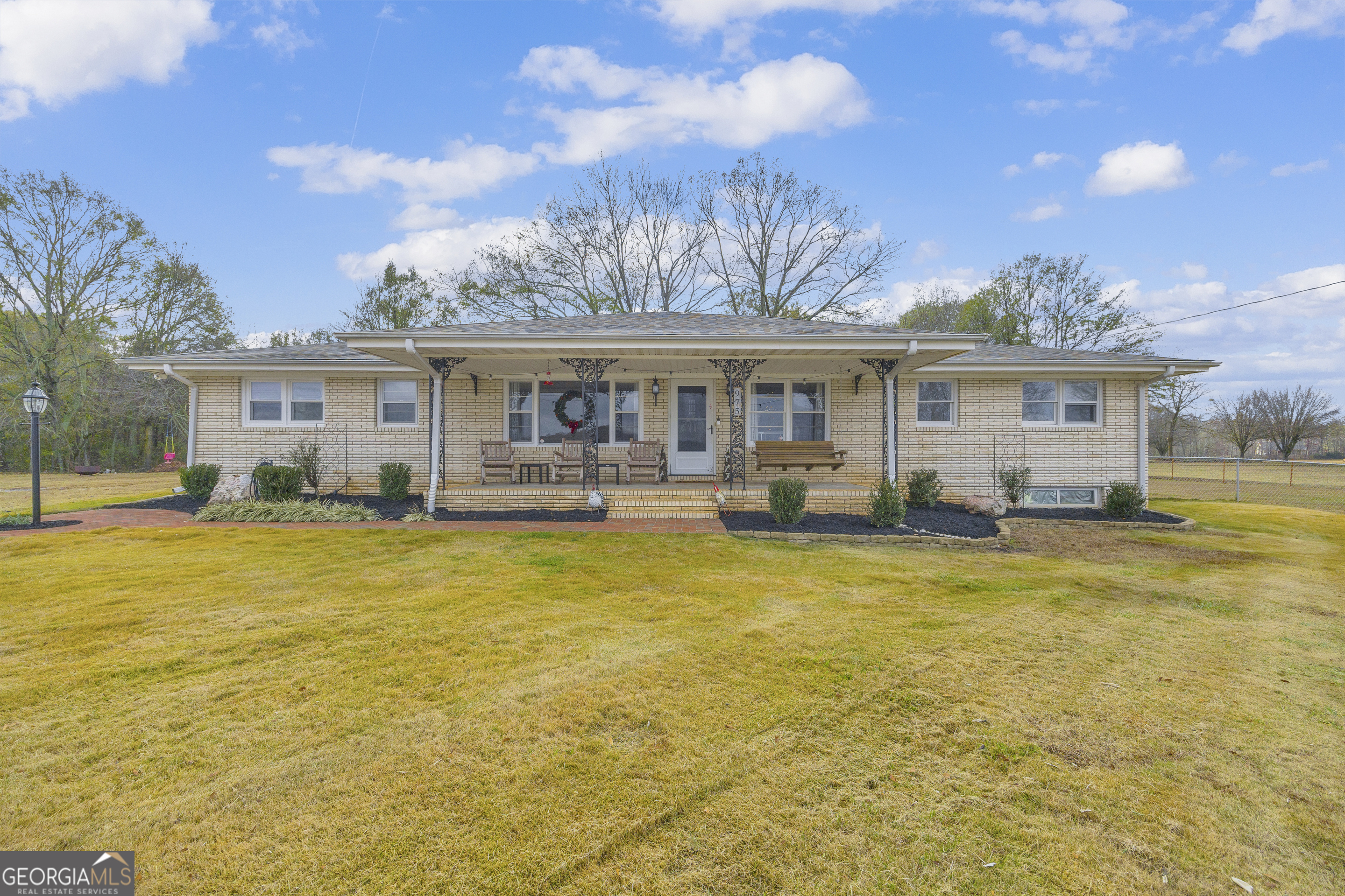 975 Diamond Hill Neese Road Colbert, GA 30628 - Photo 1 of 59 a front view of house with yard and seating area