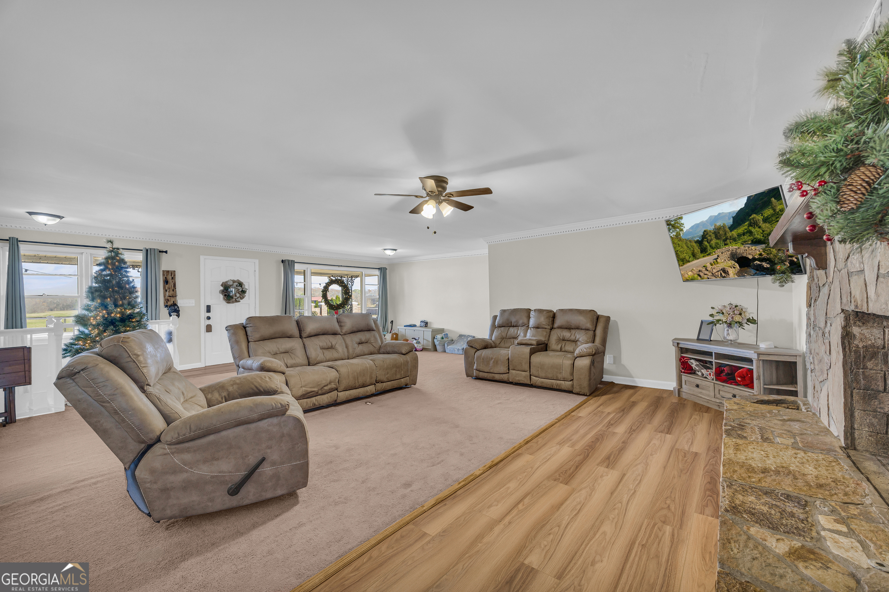 975 Diamond Hill Neese Road Colbert, GA 30628 - Photo 11 of 59 a living room with furniture and a flat screen tv