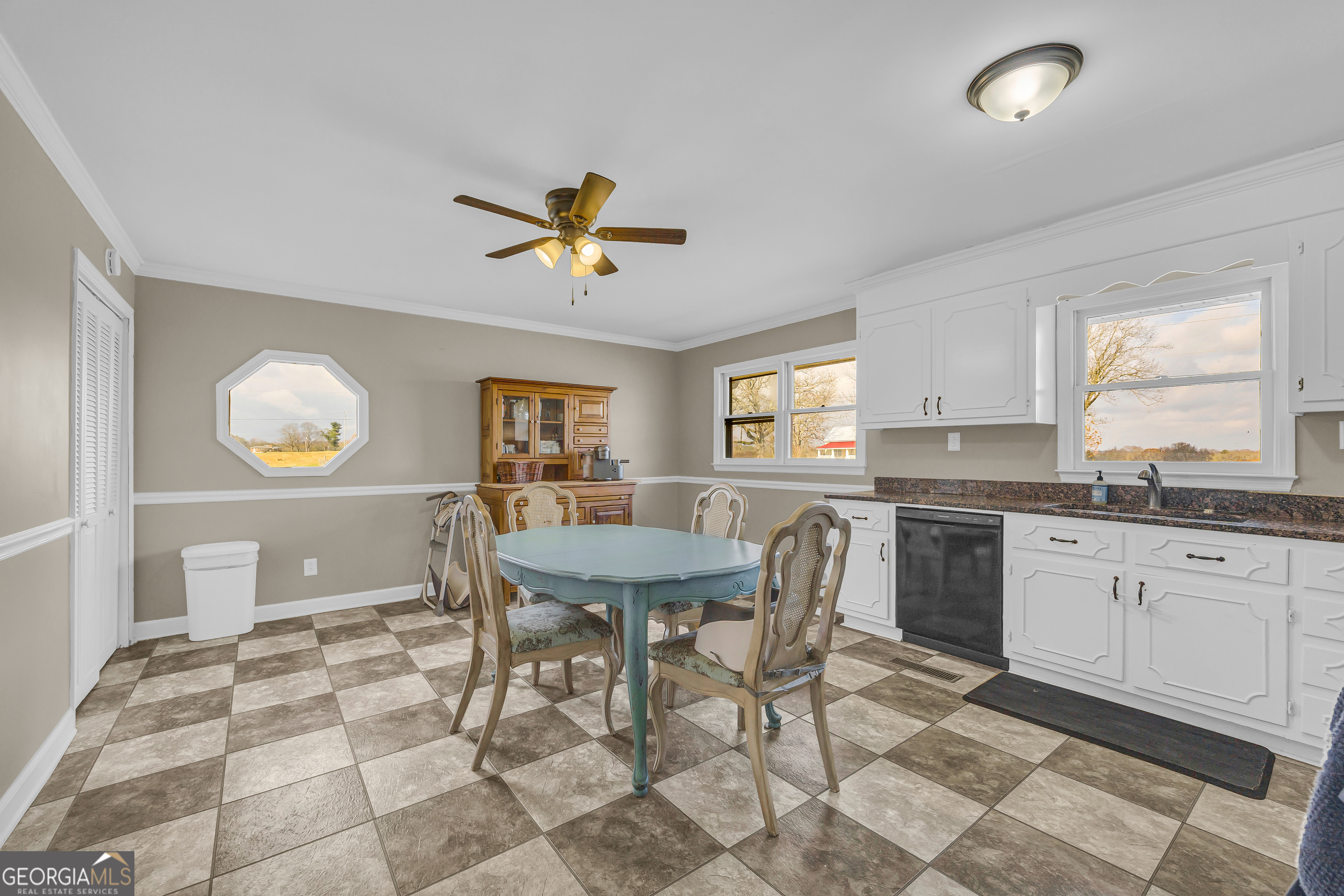 975 Diamond Hill Neese Road Colbert, GA 30628 - Photo 12 of 59 a kitchen with a dining table and chairs
