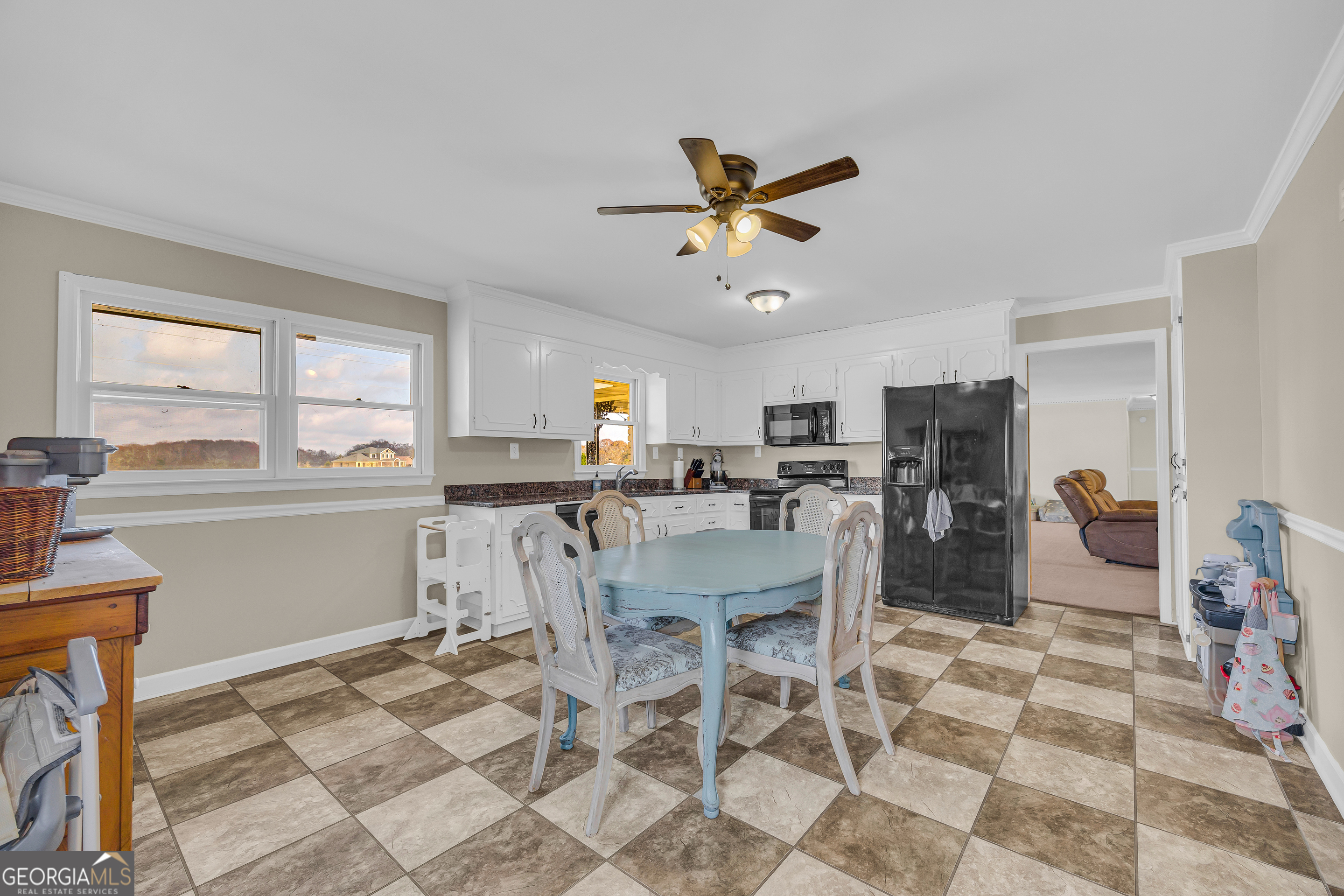 975 Diamond Hill Neese Road Colbert, GA 30628 - Photo 13 of 59 a view of a dining room with furniture and a window
