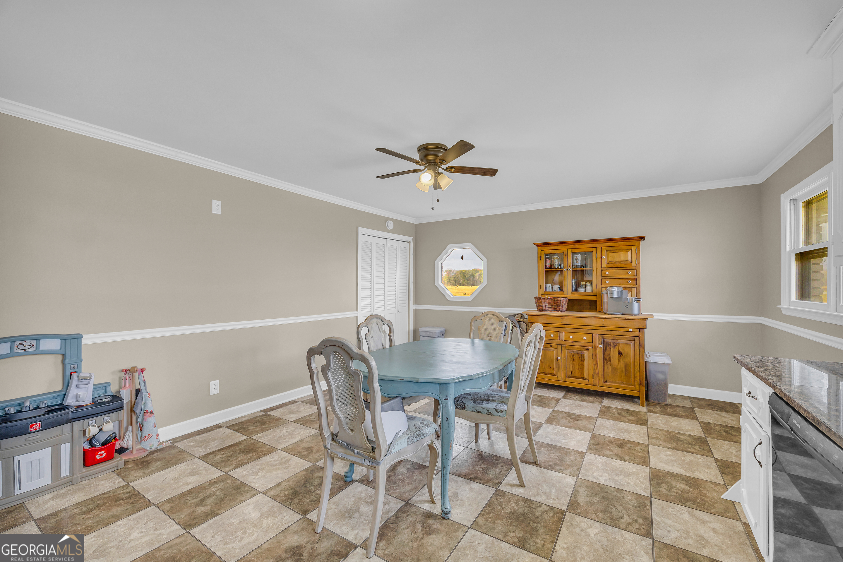 975 Diamond Hill Neese Road Colbert, GA 30628 - Photo 14 of 59 a view of a dining room with furniture and a chandelier