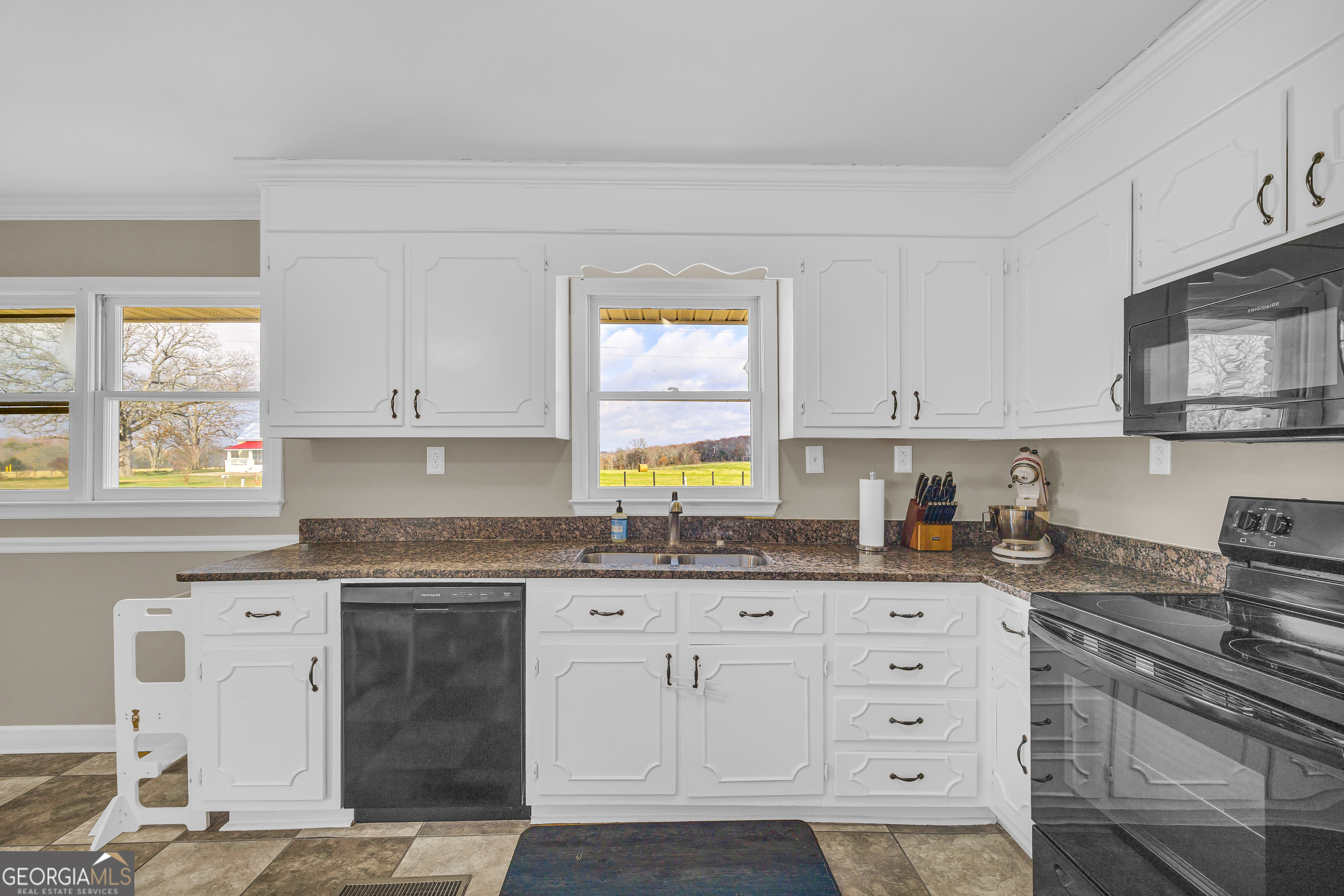 975 Diamond Hill Neese Road Colbert, GA 30628 - Photo 15 of 59 a kitchen with granite countertop a sink cabinets stainless steel appliances and a window