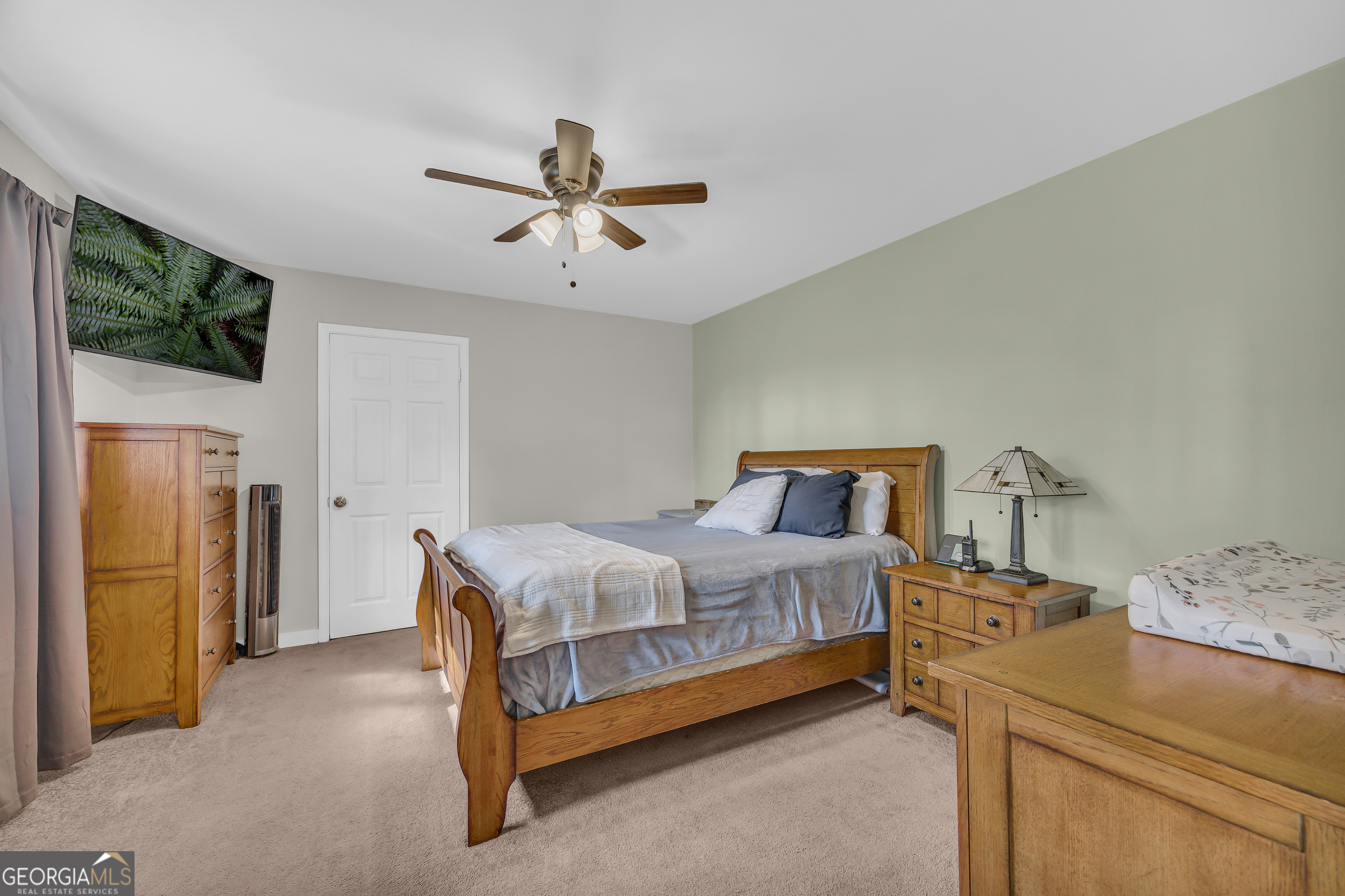 975 Diamond Hill Neese Road Colbert, GA 30628 - Photo 19 of 59 a bedroom with a bed and a television