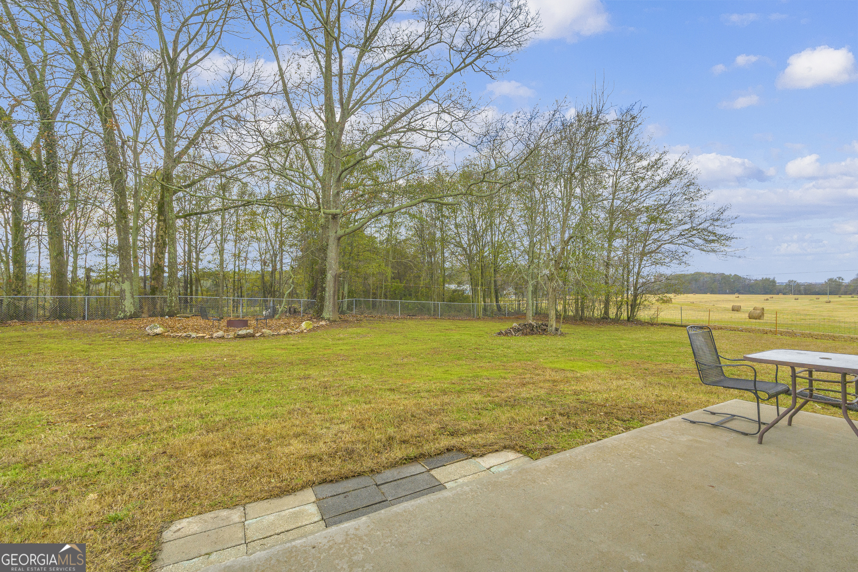 975 Diamond Hill Neese Road Colbert, GA 30628 - Photo 33 of 59 a view of a swimming pool with lawn chairs under an umbrella