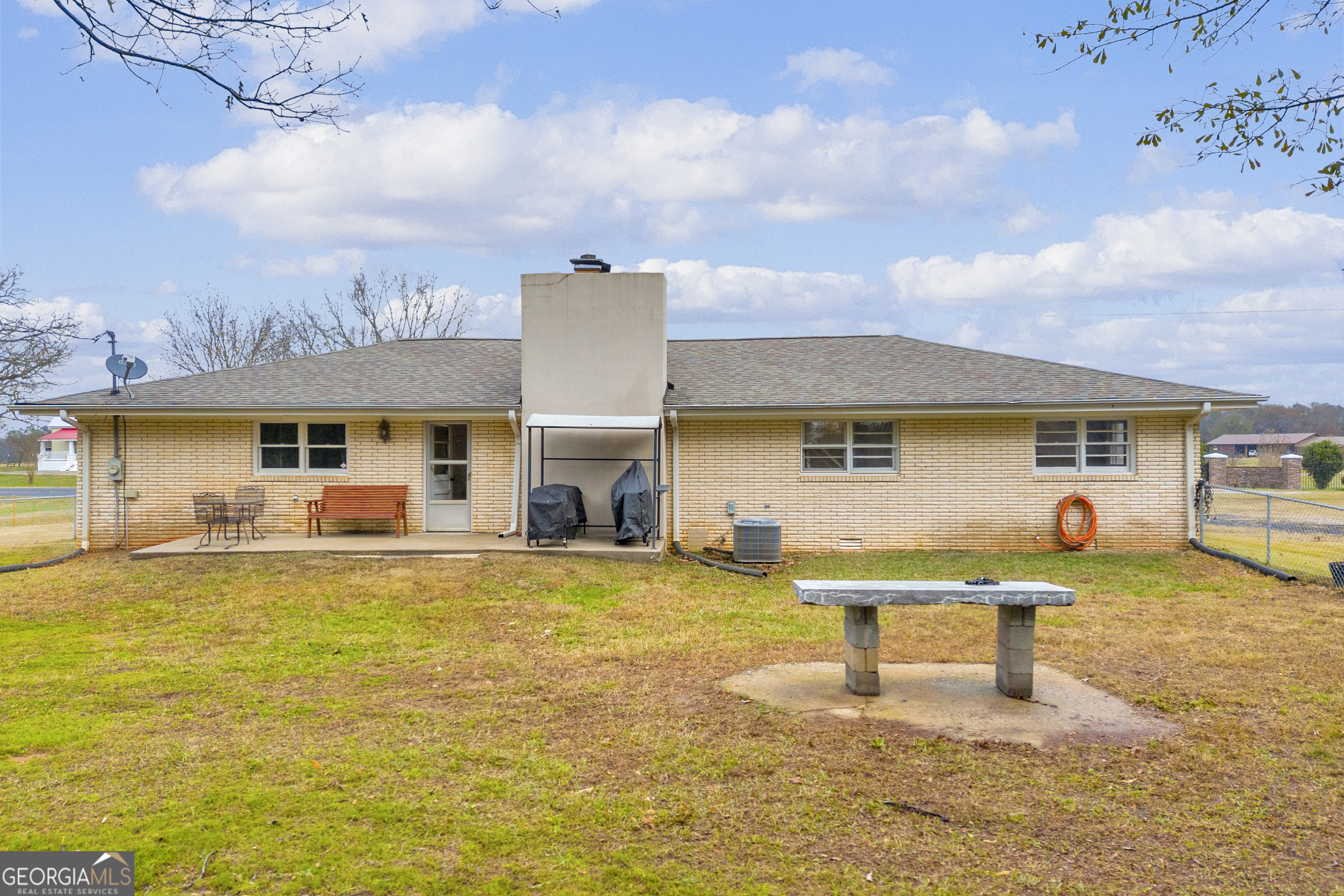 975 Diamond Hill Neese Road Colbert, GA 30628 - Photo 35 of 59 a swimming pool view with a seating space
