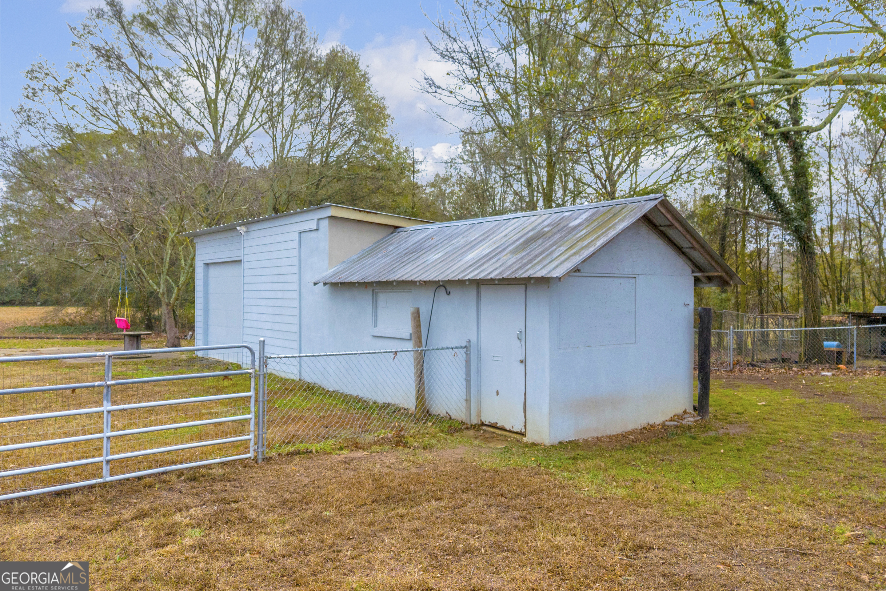 975 Diamond Hill Neese Road Colbert, GA 30628 - Photo 36 of 59 a view of backyard with wooden fence and large trees