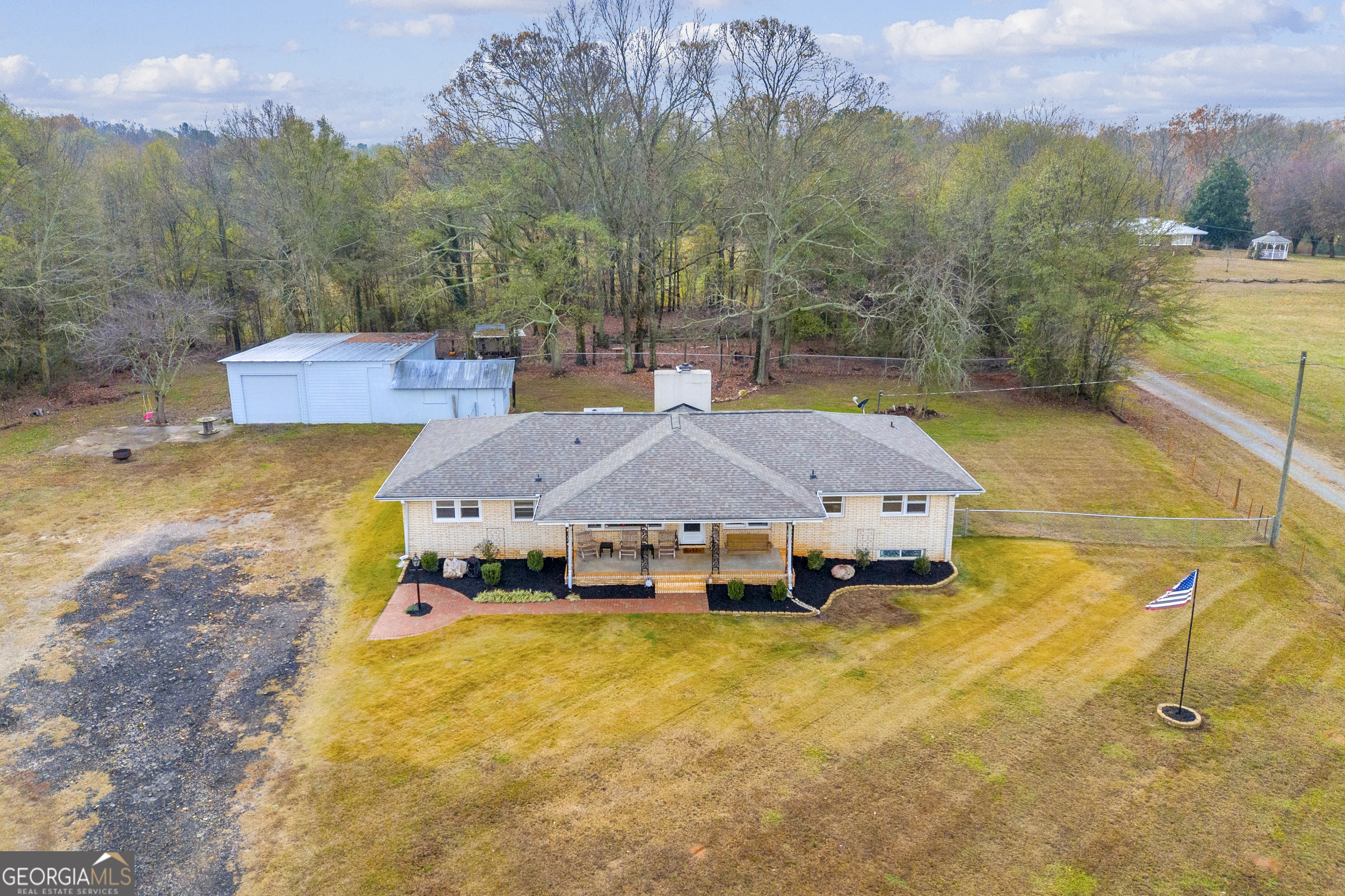 975 Diamond Hill Neese Road Colbert, GA 30628 - Photo 40 of 59 a aerial view of a house with swimming pool and mountains