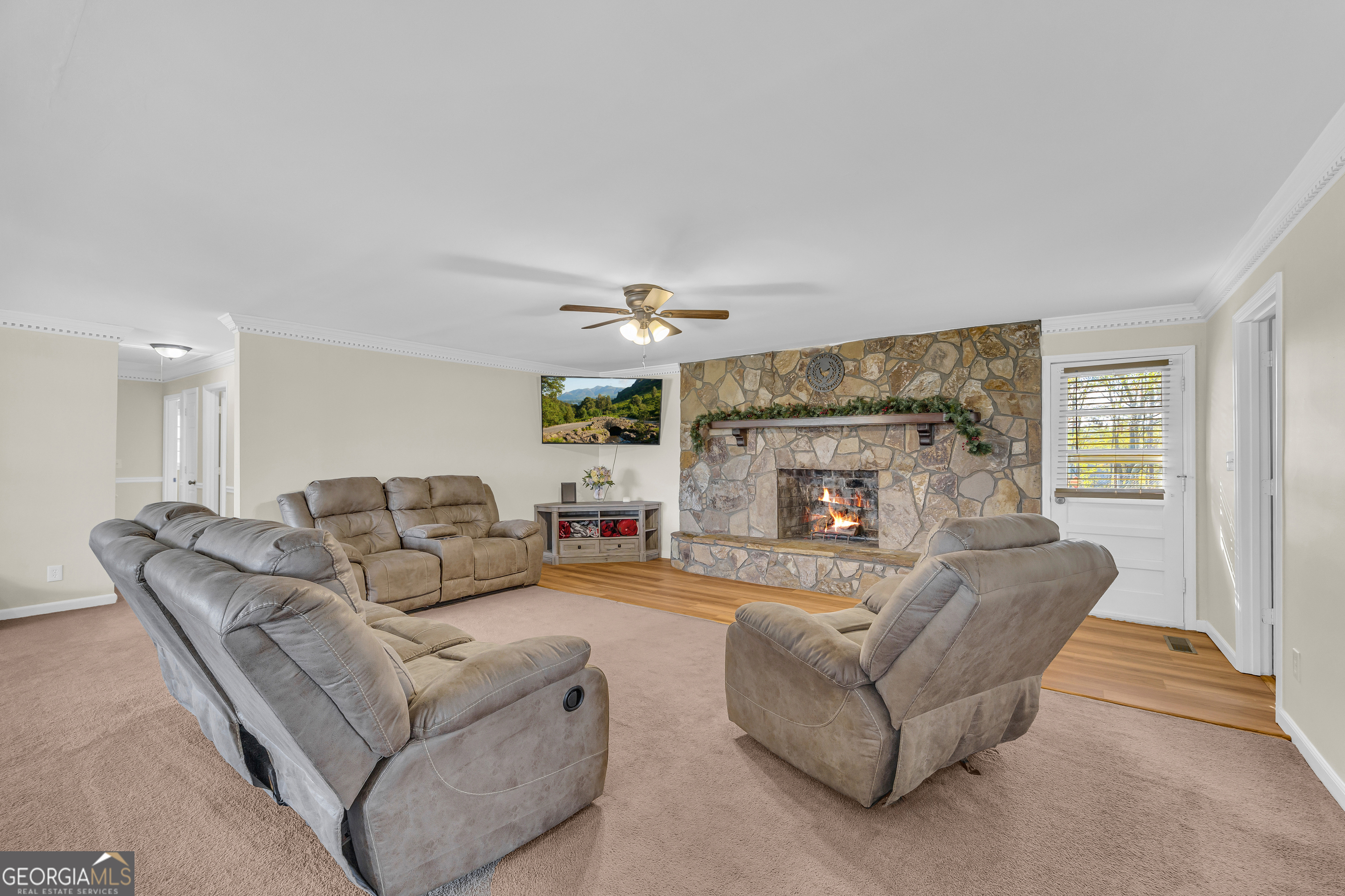 975 Diamond Hill Neese Road Colbert, GA 30628 - Photo 8 of 59 a living room with furniture and a fireplace