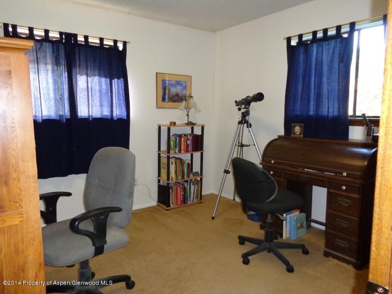 416 East 11th Street Rifle, CO 81650 - Photo 16 of 44 a view of a workspace with furniture and a window