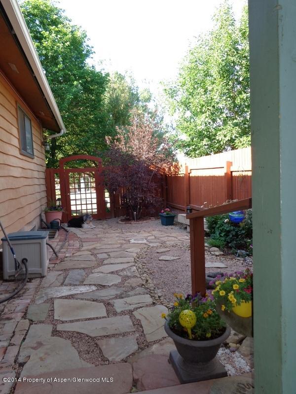 416 East 11th Street Rifle, CO 81650 - Photo 36 of 44 a view of a backyard with potted plants