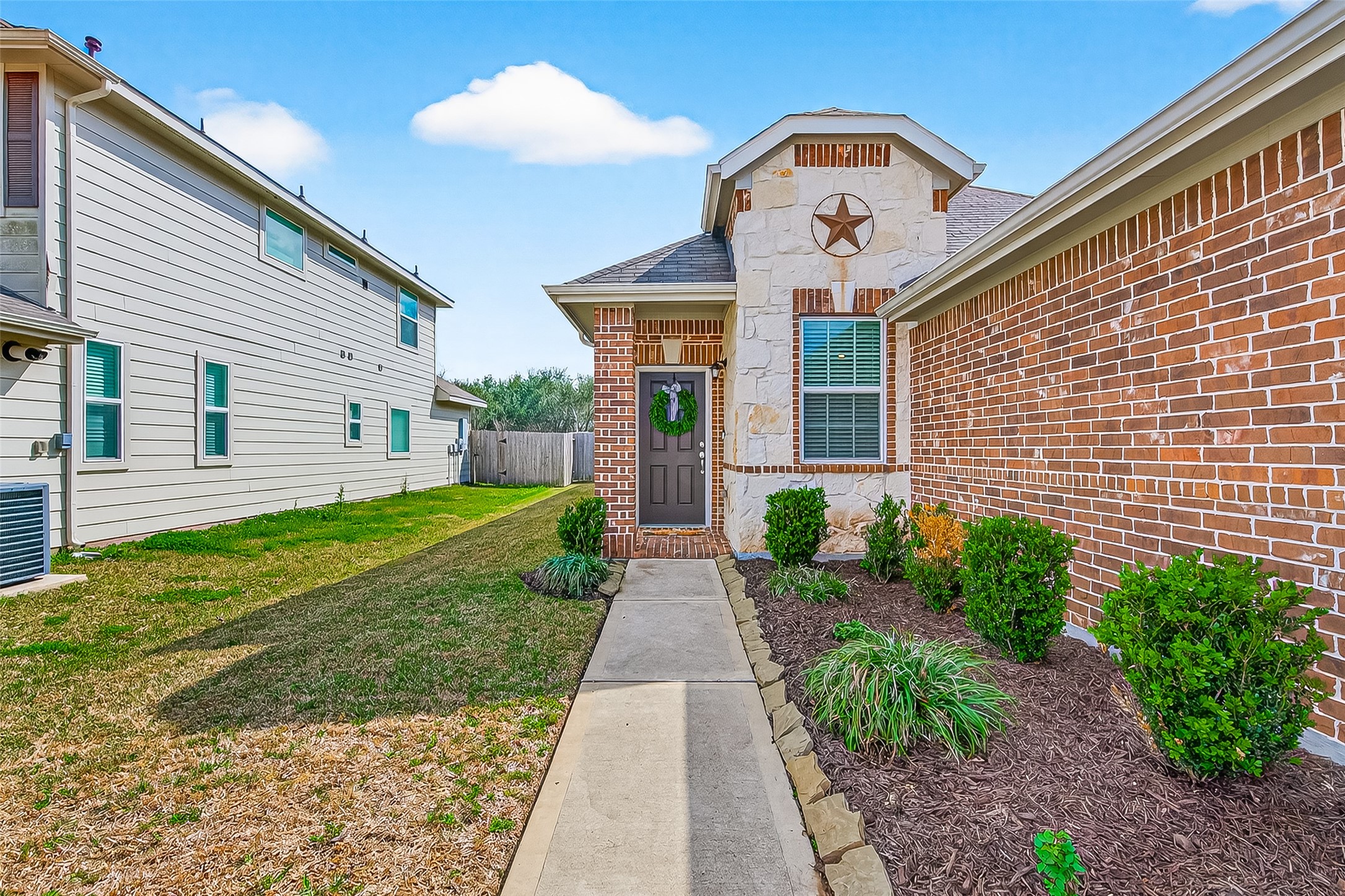 6027 Prince Place Drive Rosenberg, TX 77471 - Photo 2 of 39 a front view of a house with garden