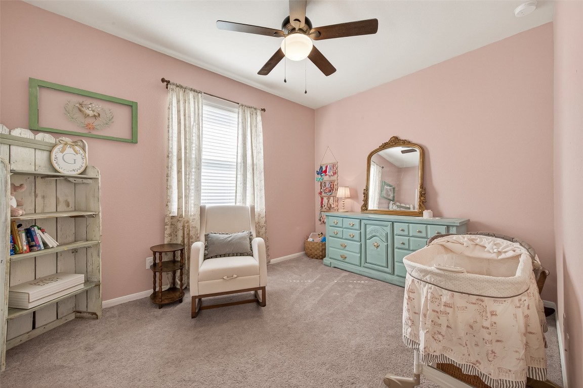 6027 Prince Place Drive Rosenberg, TX 77471 - Photo 24 of 39 This carpeted bedroom is filled with light, creating a peaceful vibe that’s just right for a nursery or a bright home office.