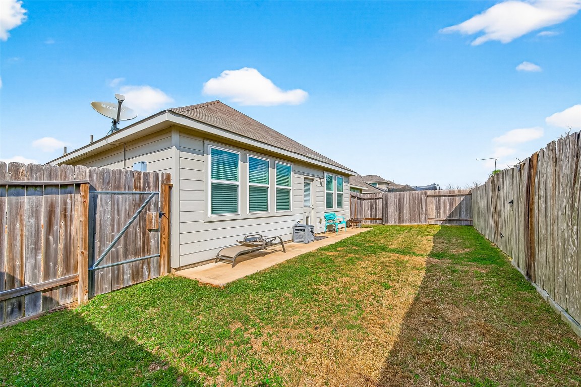 6027 Prince Place Drive Rosenberg, TX 77471 - Photo 38 of 39 A wide-open, fenced-in yard with a blanket of well-maintained grass. It’s a clean slate for a grill, a garden, or just letting the dog run wild.