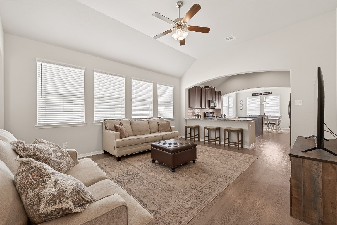 6027 Prince Place Drive Rosenberg, TX 77471 - Photo 5 of 39 The whole house breathes thanks to high ceilings and wide archways that frame the kitchen while keeping everyone part of the conversation.