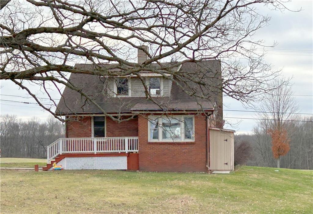 2503 Nashua Road New Castle, PA 16105 - Photo 2 of 10 a house that has tree in front of it