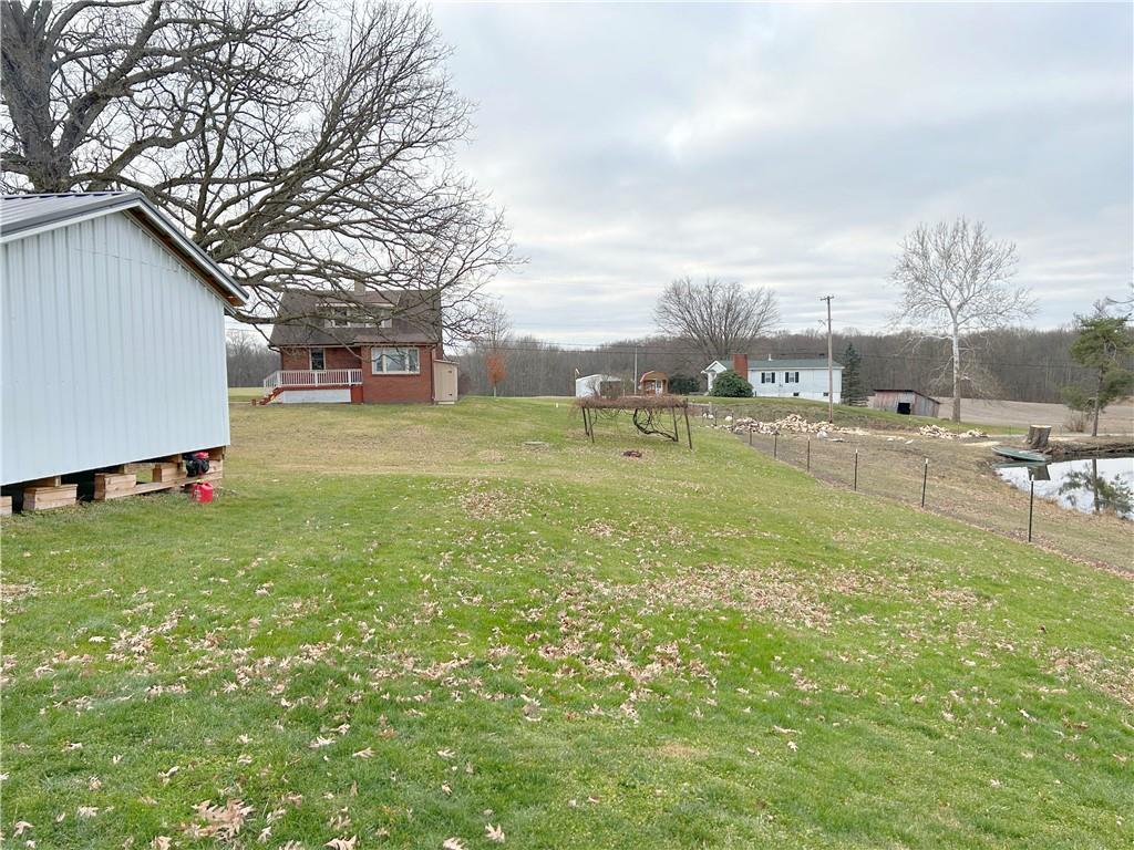 2503 Nashua Road New Castle, PA 16105 - Photo 3 of 10 a backyard of a house with lots of green space and fountain