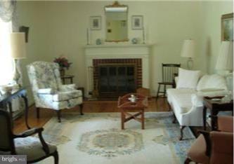 12230 Dover Road Owings Mills, MD 21117 - Photo 3 of 8 Formal Living Rm w/ wood burning FP & wood floors
