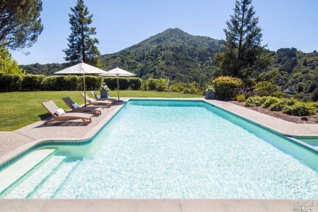 15 Blue Ridge Road Kentfield, CA 94904 - Photo 1 of 1 a view of swimming pool with lawn chairs under an umbrella