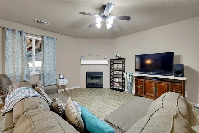 a bedroom with a large bed and a flat screen tv