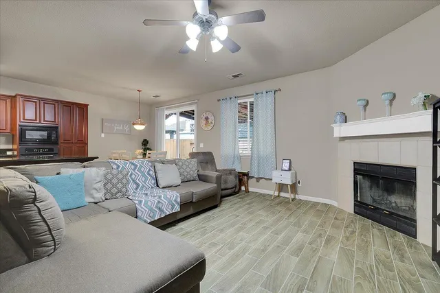 a living room with furniture and a fireplace