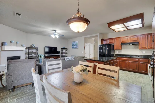 a kitchen with sink microwave refrigerator and stove