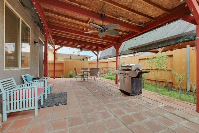 a view of a backyard with sitting area