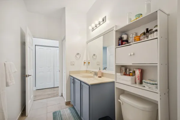 a room with a sink and a mirror