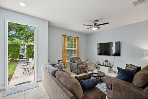 a living room with furniture and a flat screen tv