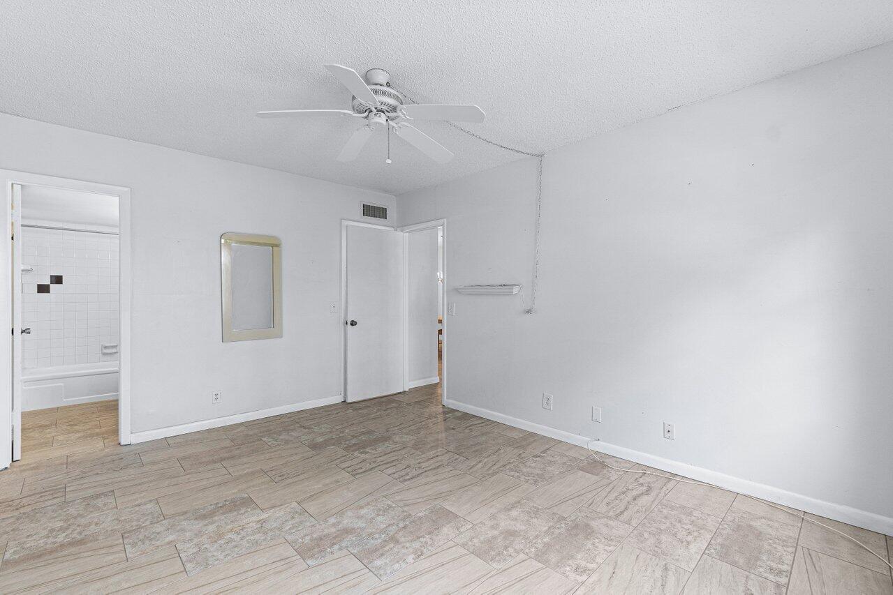 2820 Southwest 22nd Avenue, Unit 2040 Delray Beach, FL 33445 - Photo 13 of 15 Primary Bedroom w/ensuite
