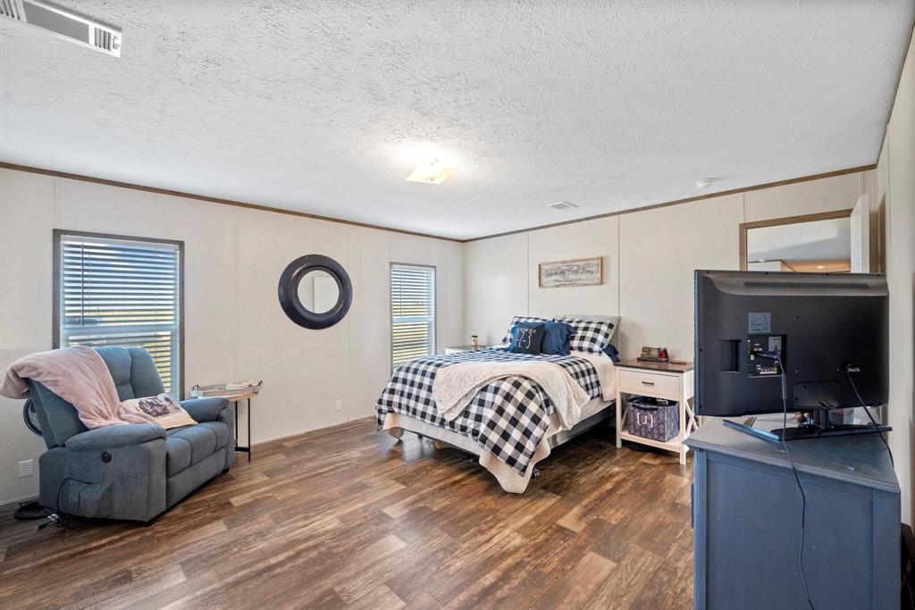 10026 County Rd NW 4350 Frost, TX 76641 - Photo 20 of 33 a living room with furniture and a large window