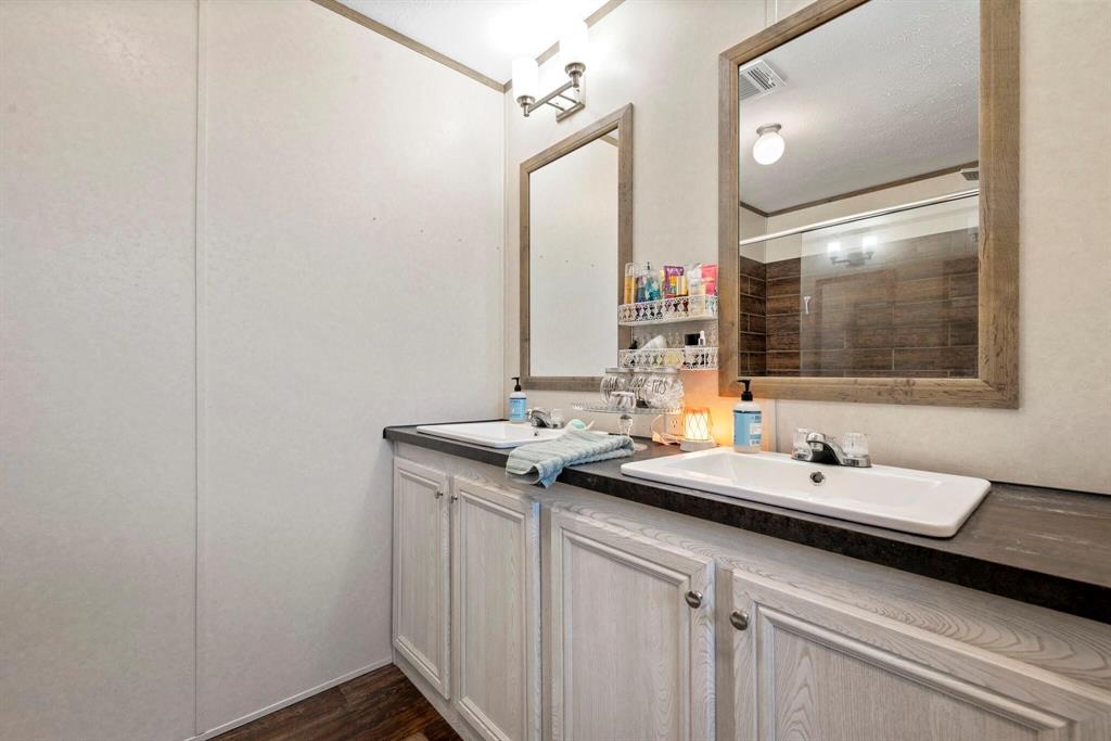 10026 County Rd NW 4350 Frost, TX 76641 - Photo 21 of 33 a bathroom with a sink and a mirror