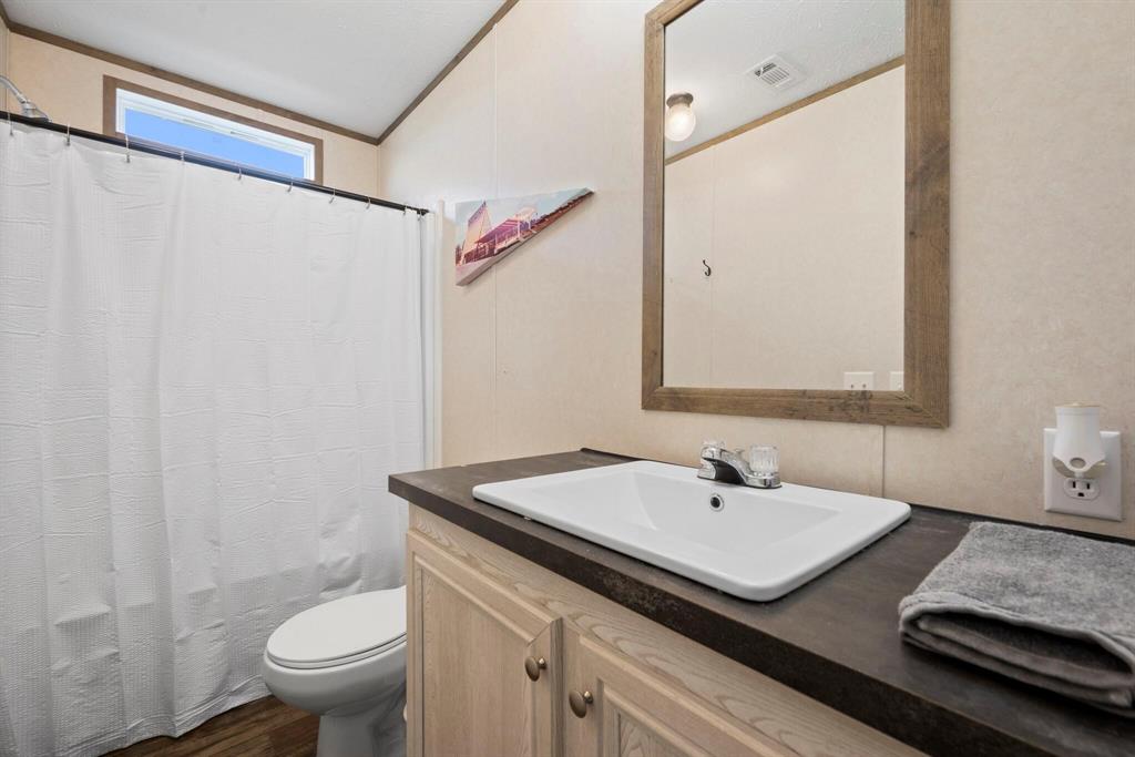 10026 County Rd NW 4350 Frost, TX 76641 - Photo 23 of 33 a bathroom with a sink and a mirror